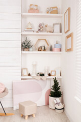 Fototapeta na wymiar Wall shelves with beautiful Christmas decor indoors. Interior design
