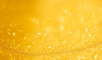 Abstract glitter yellow bokeh