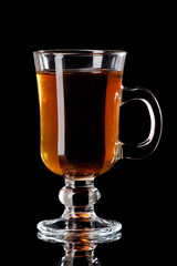 hot punch cocktail with tea lemon  isolated on black