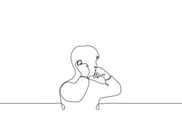 man installs hearing aid, wireless earpiece, ear microphone - one line drawing vector. ear accessories concept