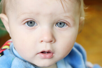 Defocused child crying in a bomb shelter. Hope for the world. Anxiety and anticipation....