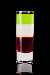 shot layered alcoholic cocktail on black background