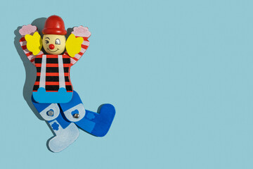 Decorative clown on blue background with copy space. 