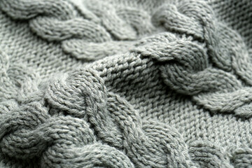 Knitted fabric with beautiful pattern as background, closeup