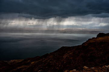 Downpour over the lake. The Dead Sea, Jordan.