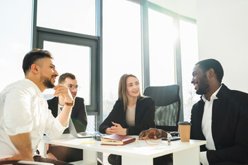 Obraz premium Multiracial office workers at morning meeting in office