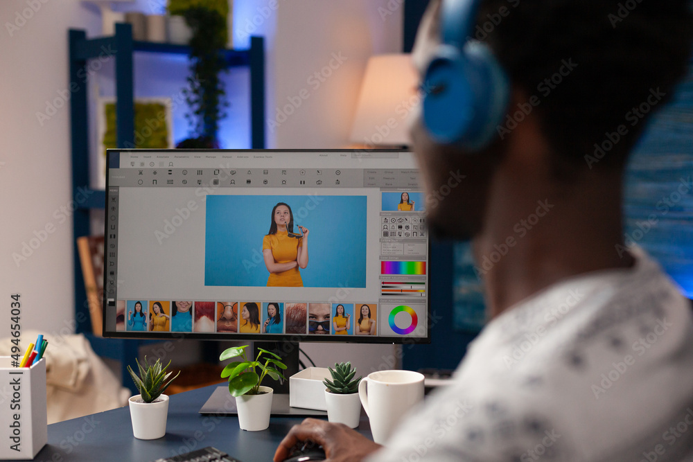 Poster photographer editor editing photos using retouching software working at picture contrast sitting at 