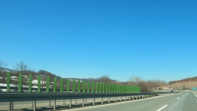 Vehicle dash cam pov video of highway ride in winter afternoon