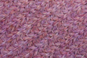 Violet knitted fabric as background, top view