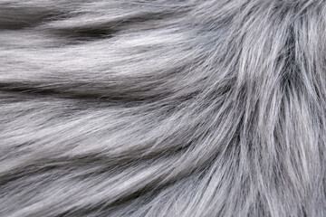Grey faux fur as background, closeup view