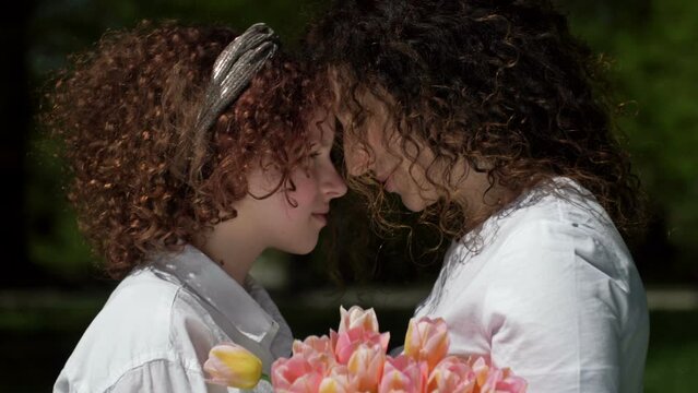 Portrait Of A Mother And Daughter Of A Teenager Looking At Each Other With Love And Tenderness. Mothers Day.