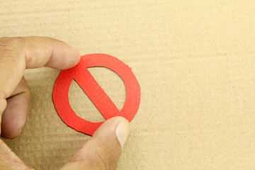 the hand holding the do not enter symbol is red