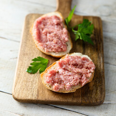 Traditional pork pate or sausage on a white bread