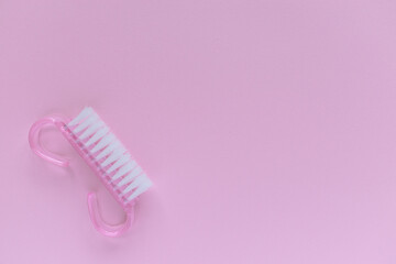 Layout of manicure accessories. Nail brush. Pink monochrome. Advertising. Place for text.