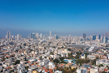 Tel Aviv skyline over neighboring Bnei Brak lower houses, Aerial view.

