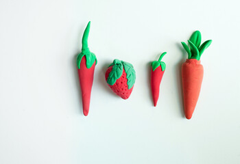 Miniature models of fruits and veggies made using soft clay. Fun craft for kids with soft clay dough.