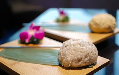 Fresh raw smashed squid paste crab ball fishball for hot pot on bamboo plate