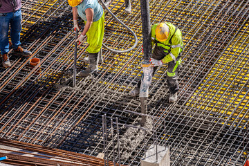 Concrete pouring on the construction site.
