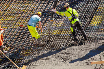 Concrete pouring on the construction site.