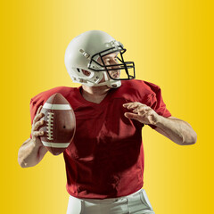 American football sportsman player with ball in action on gradient multicolored neon background, footballer in white helmet and red t-shirt ready to play.