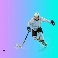 Obraz premium Professional ice hockey player hitting puck for winning goal in action on gradient multicolored neon background. Concept of sport competition.