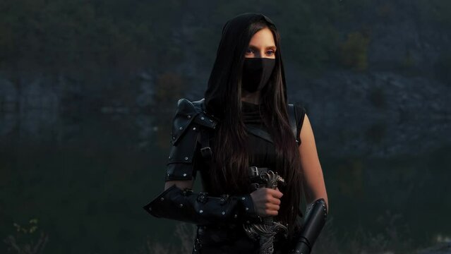 close-up portrait fantasy woman warrior assassin holding dagger in hands, hiding face behind mask. Armed girl, blue eyes. Black leather costume hood on head. Ninja soldier with knife sword. 4k footage