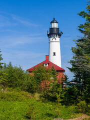 Fototapeta na wymiar Michigan lighthouse au sable lighthouse lighthouse with blue sky