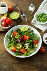 Healthy leaf salad with strawberry and avocado