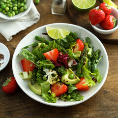 Healthy leaf salad with strawberry and avocado