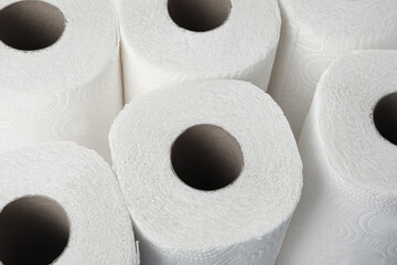 Rolls of paper towels as background, closeup view