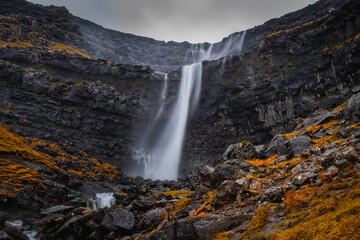 Fossa Waterfall on island Bordoy. This is the highest waterfall in the Faroe Islands, situated in wild scandinavian scenery. November 2021