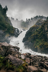 panorama view of waterfall latefossen in norway on a rainy summer day
