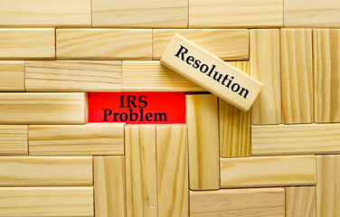 Business Concept - IRS Problem Resolution text in red on wooden blocks 