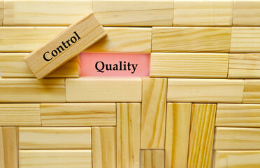 Business Teamwork Concept - wooden cubes  with words quality control  on pink  background
