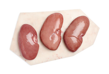 Board with fresh raw pork kidneys on white background, top view