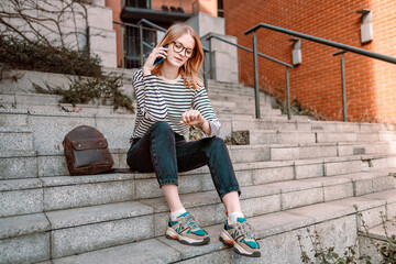 30s business woman with digital tablet looking at stylish watch on hand check the time at workplace...
