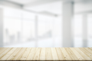 Empty office wooden table with clear modern interior with large window on background, closeup, mock...