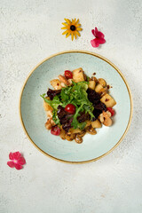 Seafood salad served in white plate closeup