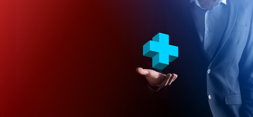 Businessman hold 3D plus icon, man hold in hand offer positive thing such as profit, benefits, development, CSR represented by plus sign.The hand shows the plus sign