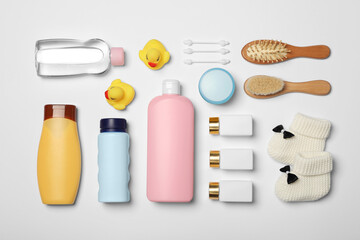 Flat lay composition with baby cosmetic products on white background