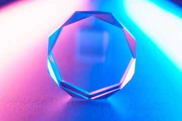 Optical glass objects with multi-colored lighting. Neon background with geometric shapes, soft selective focus.