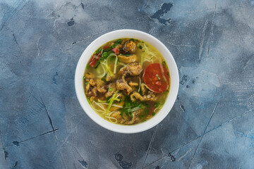 Vietnamese cuisine food on gray textured background. Soup