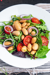 salad white bean tomato, leaves mix lettuce fresh healthy meal diet snack on the table copy space food background 