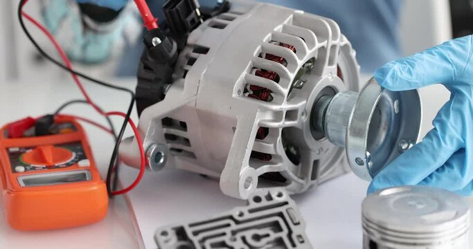 Car alternator repair test of copper coil stator closeup