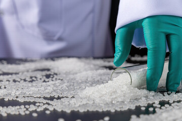 white plastic grain, plastic polymer granules,hand hold Polymer pellets, Raw materials for making...