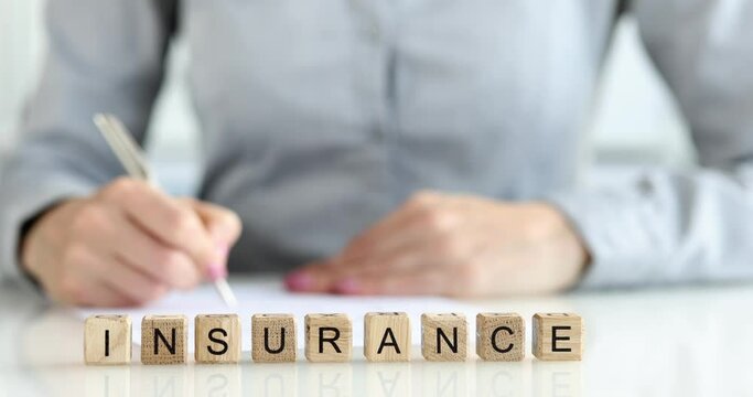 Completing insurance form for company reference closeup
