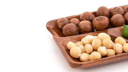 Macadamia fruits isolated on white background.