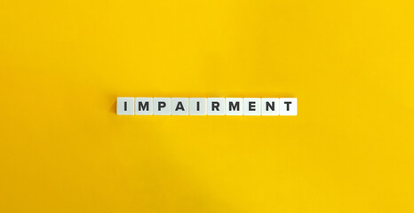Impairment in Corporate Finance and Accounting. Letter Tiles on Yellow Background. Minimal Aesthetics.