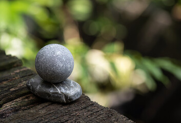 Zen stone on bokeh nature background.Space for text.