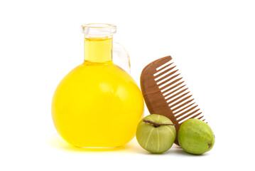 Indian Gooseberry or phyllanthus emblica fruits and oil isolated on white background.